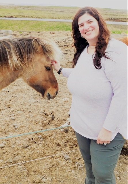 Erica, travel advisor, meeting an Icelandic horse